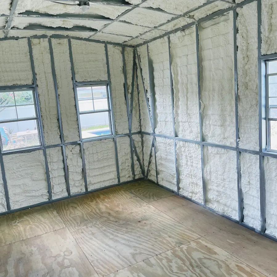 Closed-cell spray foam insulation applied to wall cavities in a residential project in Seaside